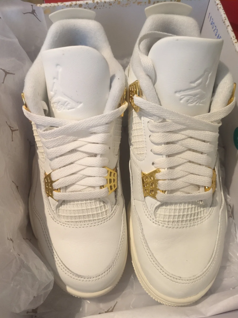 Air Jordan Women's All-White Sneakers with Gold Accents
